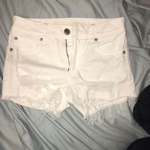 white ripped shorts